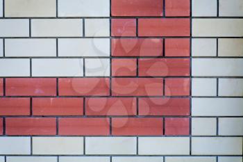 Brick wall background. Red and white bricks,  a lot of copyspace. Wall of a modern building as backdrop