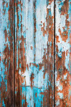 Weathered wood planks half painted in blue vertical image