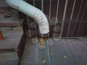Drainage pipe. Tube drain of aparment building near staircase -Architectural Detail