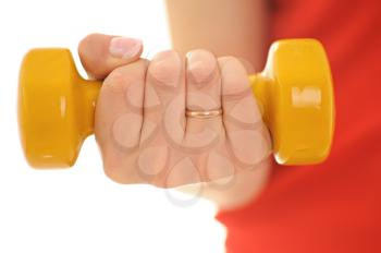 Royalty Free Photo of a Woman Using a Dumbbell