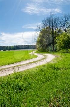 Royalty Free Photo of a Road Near a Field