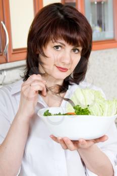 Royalty Free Photo of a Woman Eating