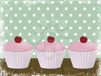 cherry cupcakes on a wooden table with polka-dot background and grunge