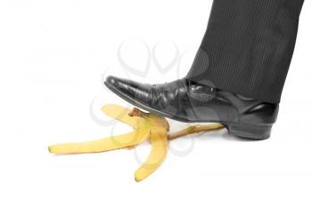 Royalty Free Photo of a Man Stepping on a Banana Peel