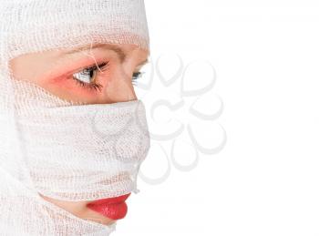 Royalty Free Photo of a Woman With Bandages on Her Face