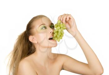 Royalty Free Photo of a Woman Eating Grapes