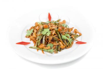 Tasty salad of mushrooms and vegetable dish close up on a white background