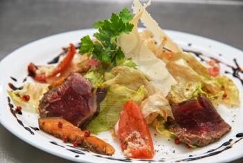 Royalty Free Photo of a Salad With Roast Beef and Vegetables