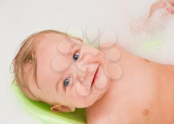 Royalty Free Photo of a Baby Boy Getting a Bath