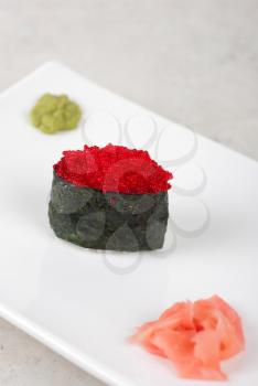 Red tobiko with flying fish roe sushi closeup