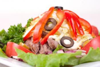 spicy salad of roast beef with potato, tomato, cabbage, pepper and lettuce