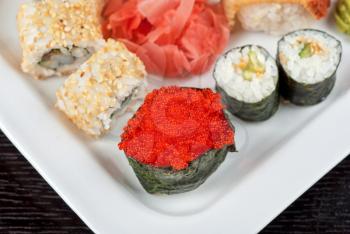 japanese sushi set with red tobiko sushi in the foreground