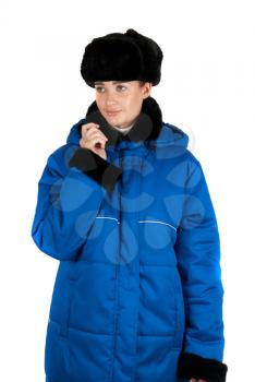 Girl at blue quilted coat on a white