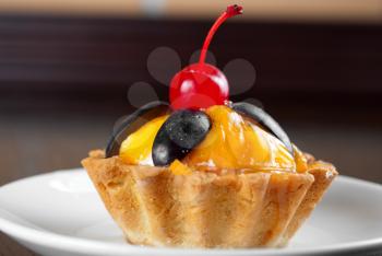 fresh baked cupcake closeup on a wooden table