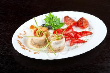 fillet of pikeperch stuffed with trout fish with baked pepper, tomato and leek