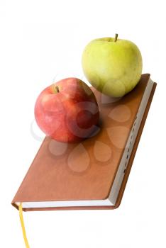 Back to school concept with books and apples on white