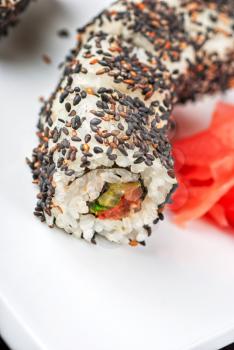Closeup of Sushi rolls at plate with sesame