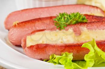 Appetizer - sausages with cheese, omelette toasts and sauce