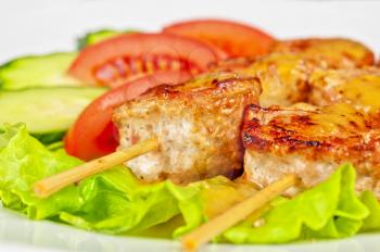 broshett- grilled fillet meat with bacon at skewer with vegetable