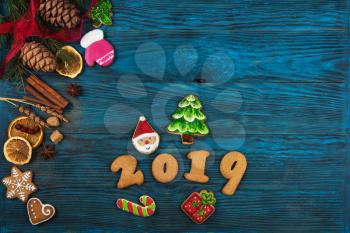 Gingerbreads for new 2019 year on wooden background, xmas theme