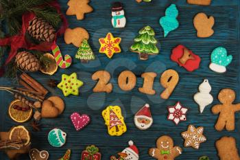 Gingerbreads for new 2019 year holiday on wooden background, xmas theme