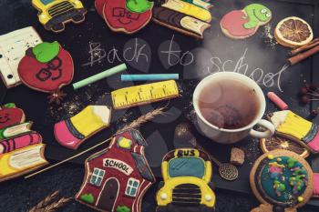 Back to school gingerbreads cookies on a dark background