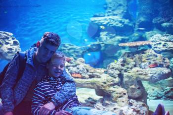 Photo of man with son in the oceanarium