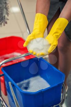 Cleaning concept. Closeup photo of woman cleaning shopping center