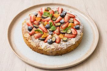 Sweet bright cakes with fruit and berries