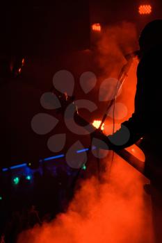 Guitar in the hands of a musician on a rock concert music