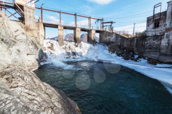 Old Hydro power station in Chemal, Altai,Siberia, Russia. Winter sunny day. A popular tourist place