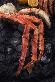 Set of seafood: red and black caviar, limb of hairy crab, limb of snow crab, far eastern kamchatka crab