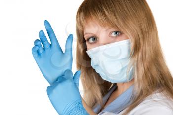 Closeup of a doctor wearing a protection mask and gloves on white