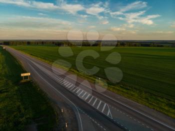 Top view of the road in summer evening. View from drone
