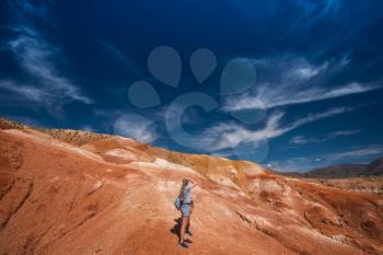 Woman with her son in valley of Mars landscapes in the Altai Mountains, Kyzyl Chin, Siberia, Russia