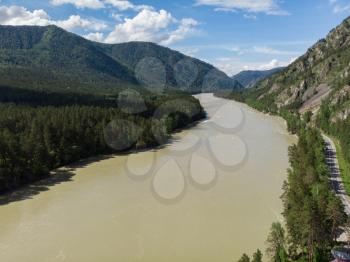 Aerial view of Katun river with road, in Altai mountains