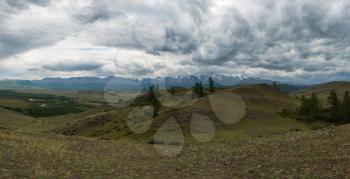Summer in Kurai steppe and North-Chui ridge of Altai mountains, Russia. Cloud day.