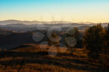 Beauty sunset in the mountains in Altay, panoramic picture. Autumn photo.