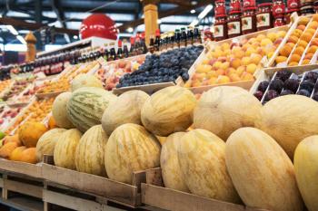 Ripe melons in farmer market: fresh organic healthy melons at grocery store.