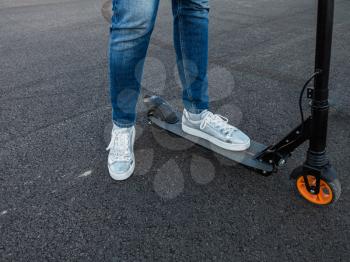 Woman riding an electric scooter outdoor