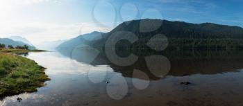 Teletskoye lake in Altai mountains, Siberia, Russia. Beauty panoramic picture in summer morning.