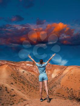 Woman on mars landscape with beauty sky sunset