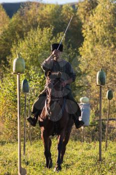 CHARISHSKOE. ALTAISKIY KRAI. WESTERN SIBERIA. RUSSIA - SEPTEMBER 15, 2016: descendants of the Cossacks in the Altai, cossack rides a horse, with a saber at the festival on September 15, 2016 in Altayskiy krai, Siberia, Russia.