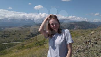 Happy woman in Altai mountains. Vacation, travel and adventure concept