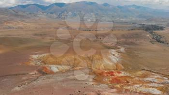 Aerial drone 4K video of colorful eroded landform of Altai mountains with yellow, brown and red colors. Nature landscape called Mars, near the border with Mongolia, Chagan-Uzun, Altai Republic, Russia