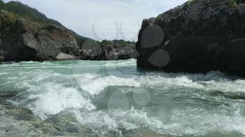 The mountain Katun river with pure, cold and turquoise water. Altai Mountains, Siberia, Russia.
