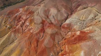Aerial drone 4K video of colorful eroded landform of Altai mountains with yellow, brown and red colors. Nature landscape called Mars, Chagan-Uzun, Altai Republic, Russia