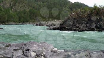 The mountain Katun river with pure, cold and turquoise water. Altai Mountains, Siberia, Russia.