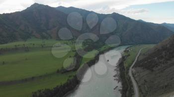 Aerial view of Katun river, in Altai mountains, in beauty summer evening, drone footage