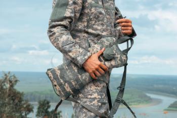 Man tourist standing in military outfit outdoor. Travel or military concept